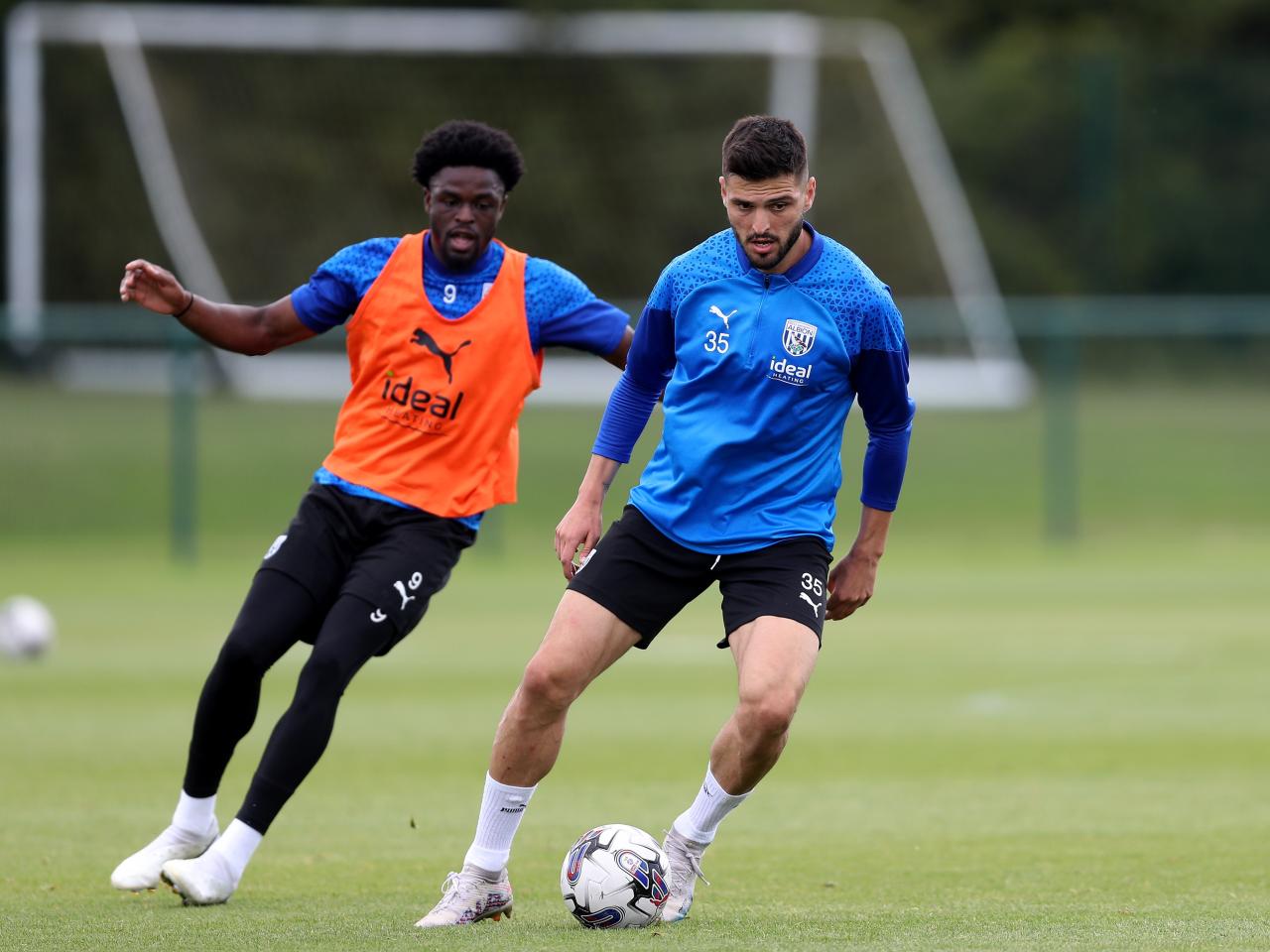 Okay Yokuslu and Josh Maja in training 
