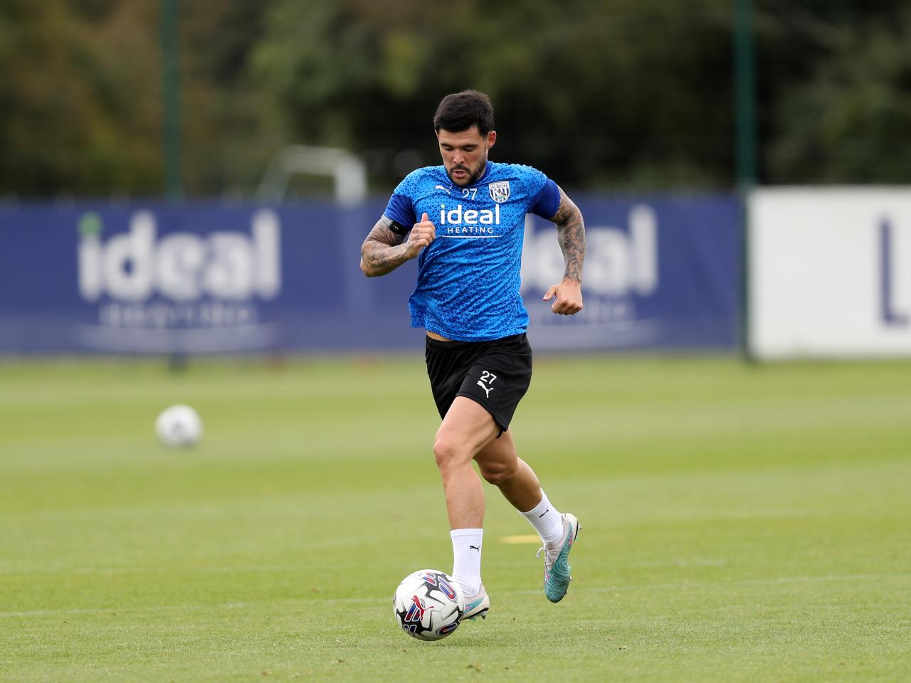 Alex Mowatt on the ball in training 
