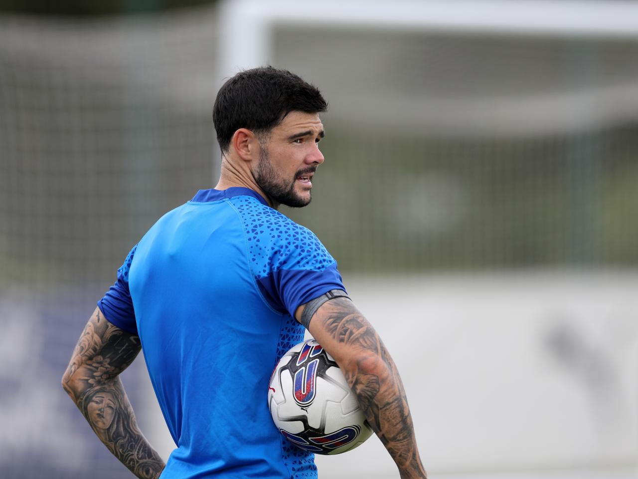 Alex Mowatt holding a football