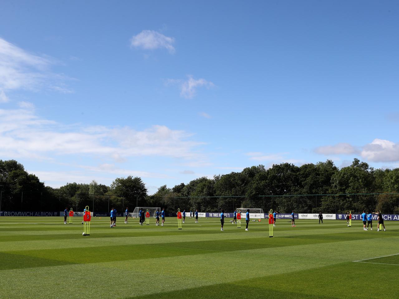 A wide view of the training pitch with the players training on it