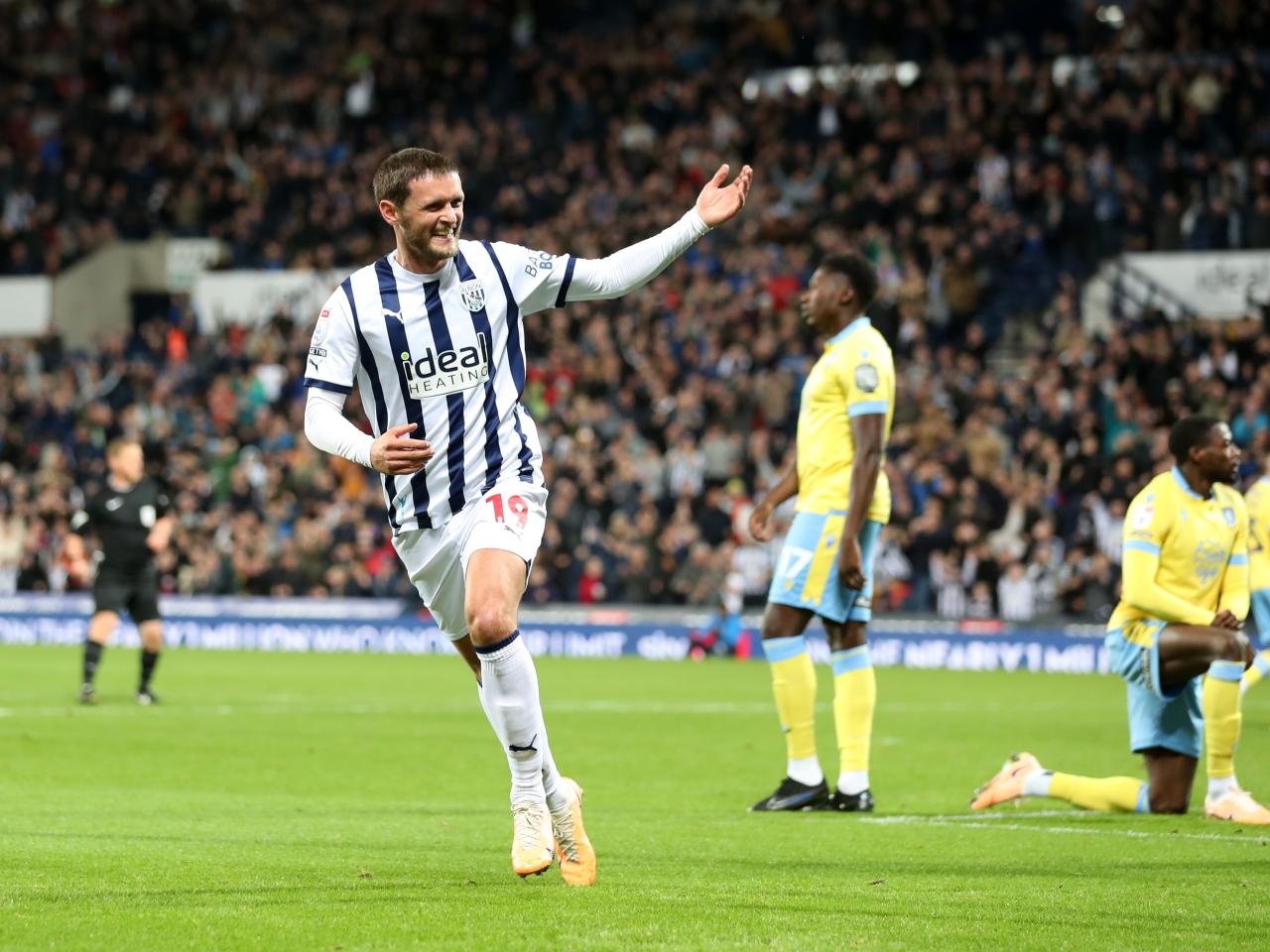 John Swift celebrates scoring against Sheffield Wednesday