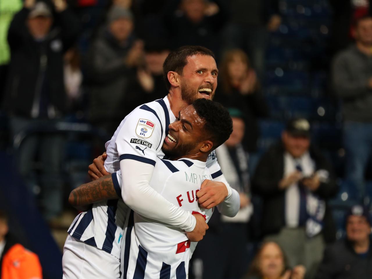 John Swift celebrates scoring against Sheffield Wednesday with Darnell Furlong