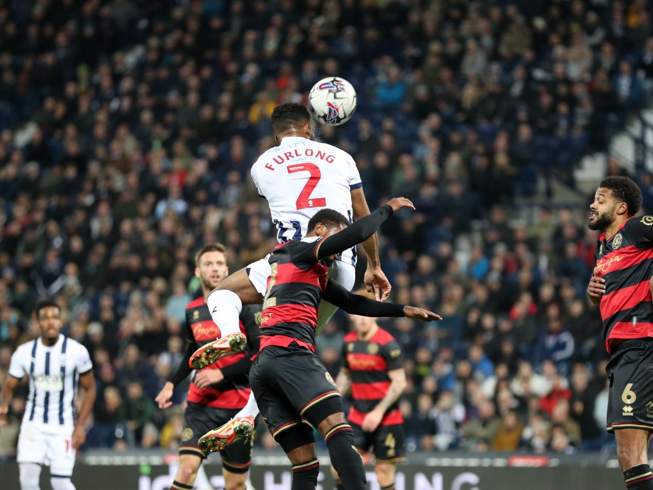 Darnell Furlong jumps highest for an aerial ball