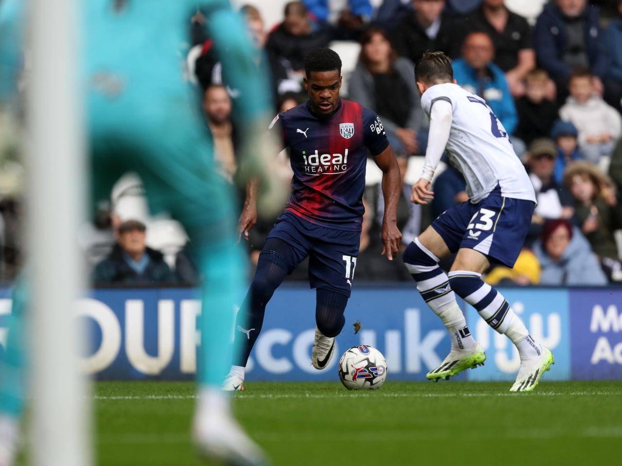 Grady Diangana takes on a Preston defender 