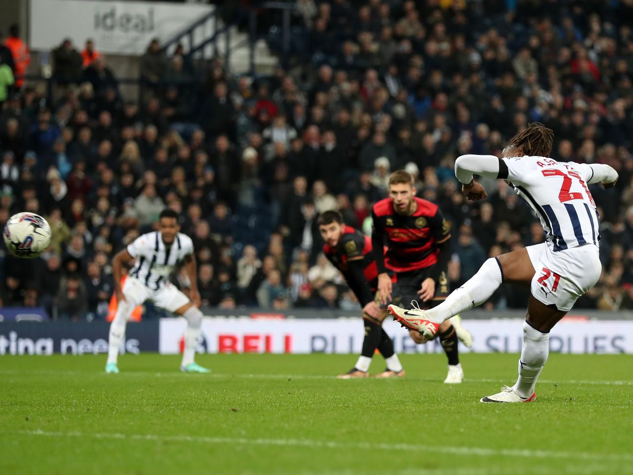 Brandon Thomas-Asante taking a penalty against QPR