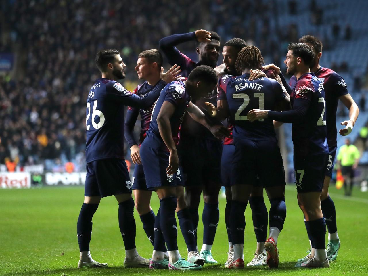 Brandon Thomas-Asante celebrates scoring against Coventry City with his team-mates