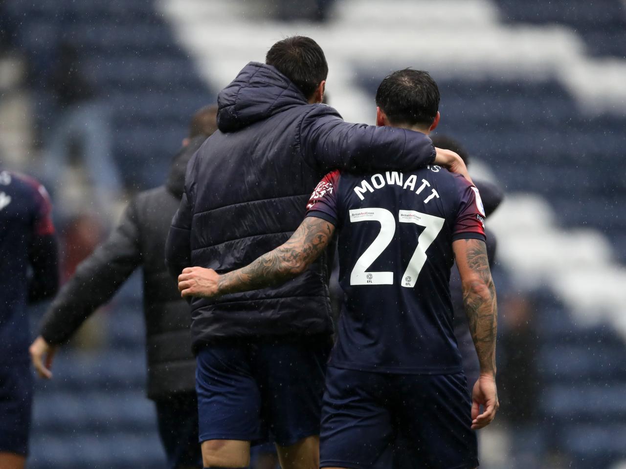 Alex Mowatt and Okay Yokuslu embrace at full time 