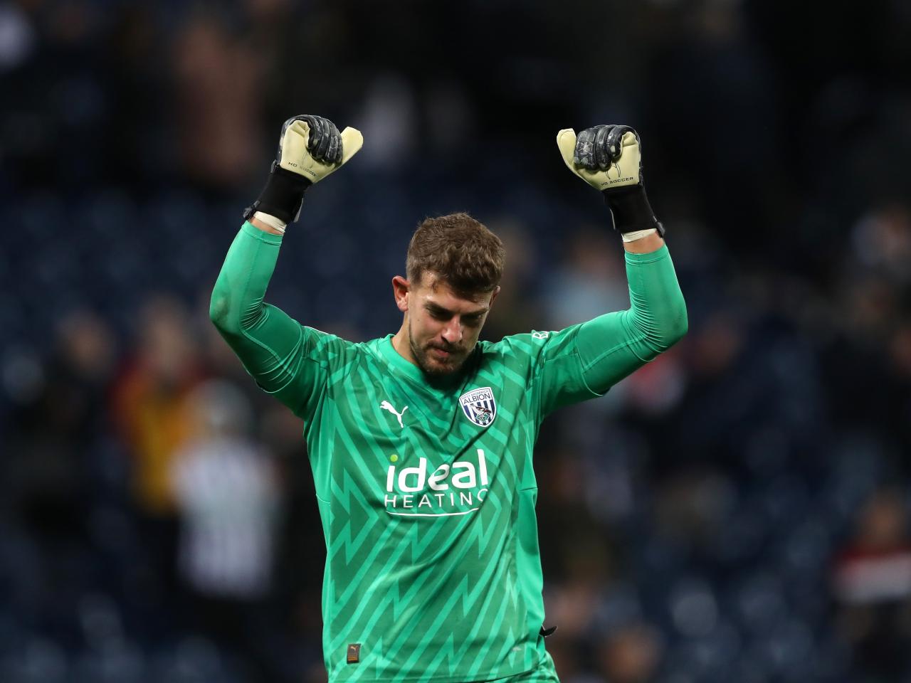 Alex Palmer celebrates victory after the final whistle