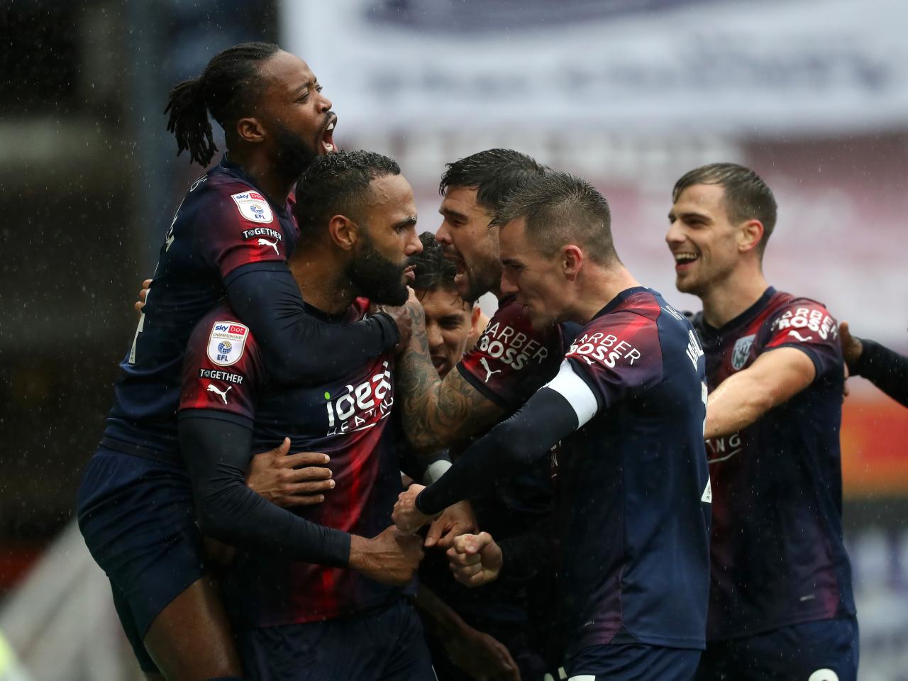 Kyle Bartley celebrates scoring against Preston with his team-mates