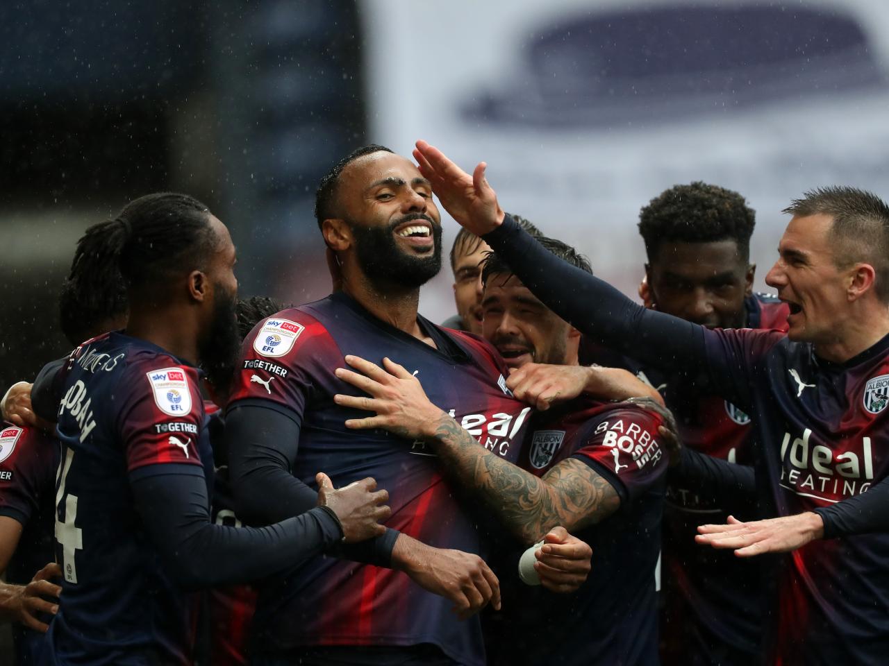 Kyle Bartley celebrates scoring against Preston with his team-mates