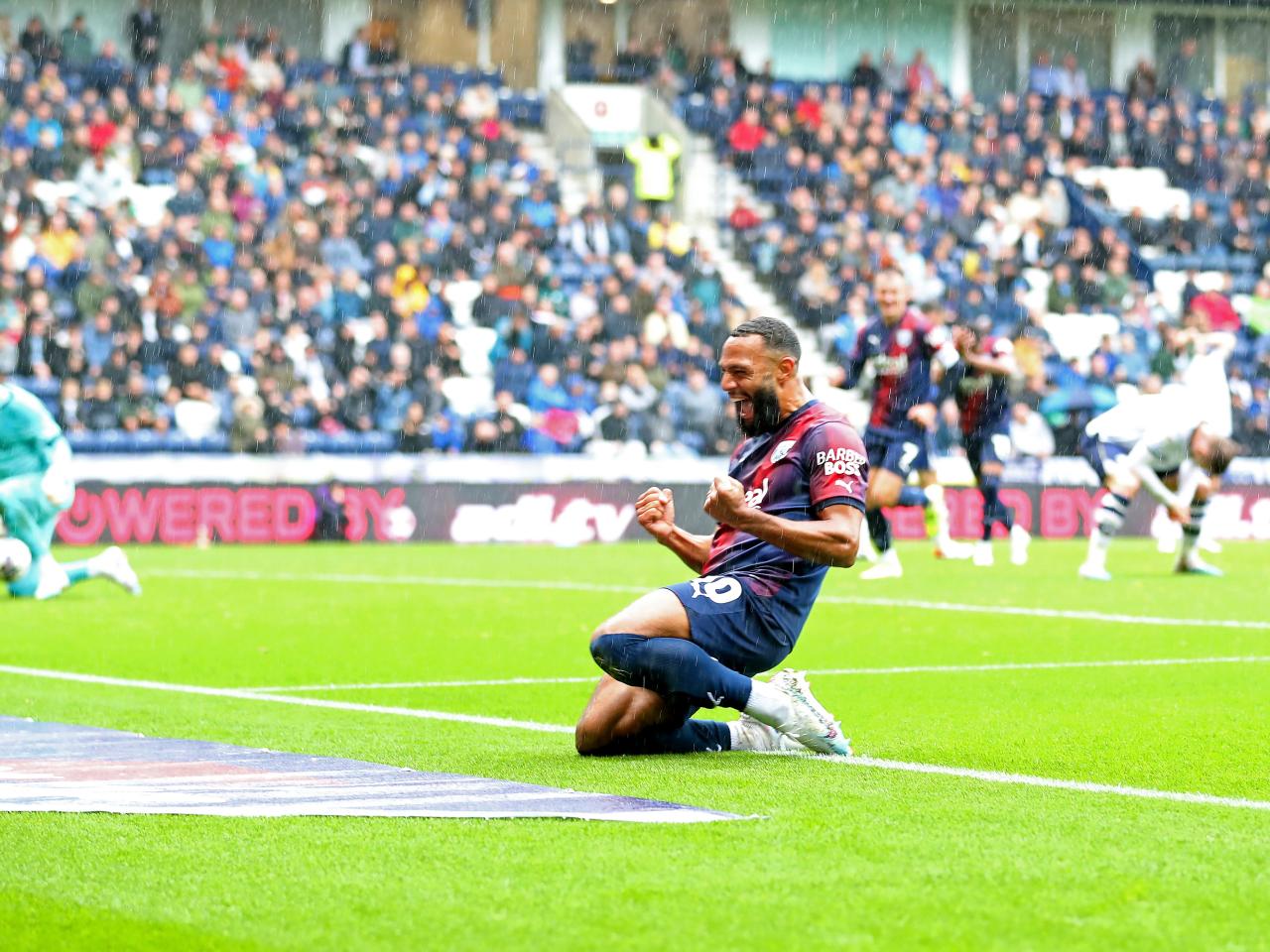 Matty Phillips celebrates scoring against Preston
