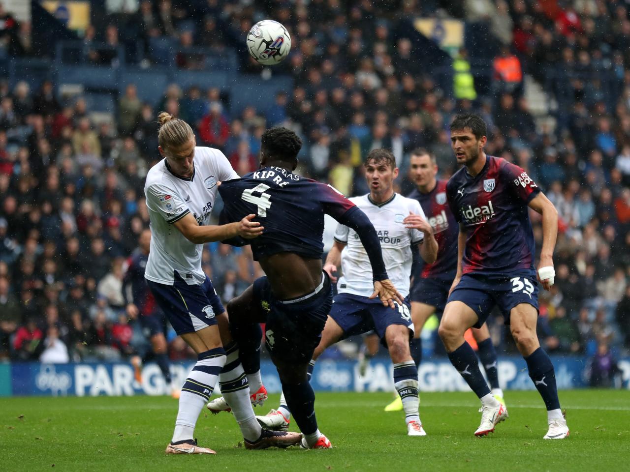 Cedric Kipre jumps for the ball against Preston