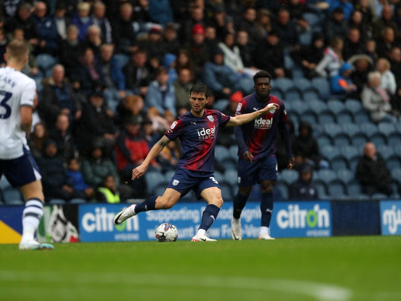 Okay Yokuslu passes the ball against Preston