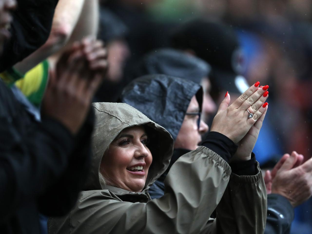 A female Albion fan clapping