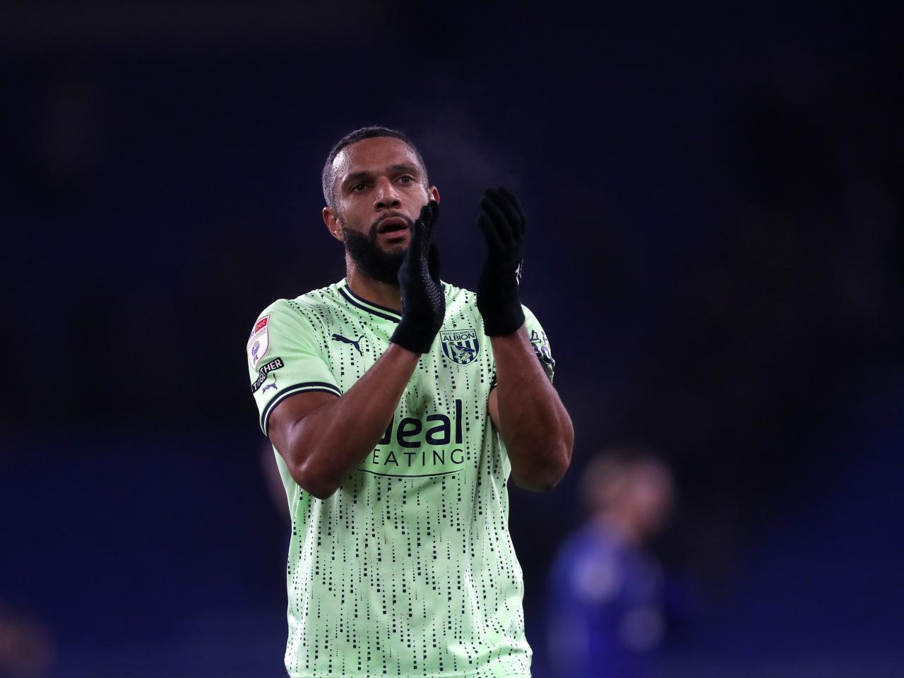 Matty Phillips applauds the travelling fans at full-time