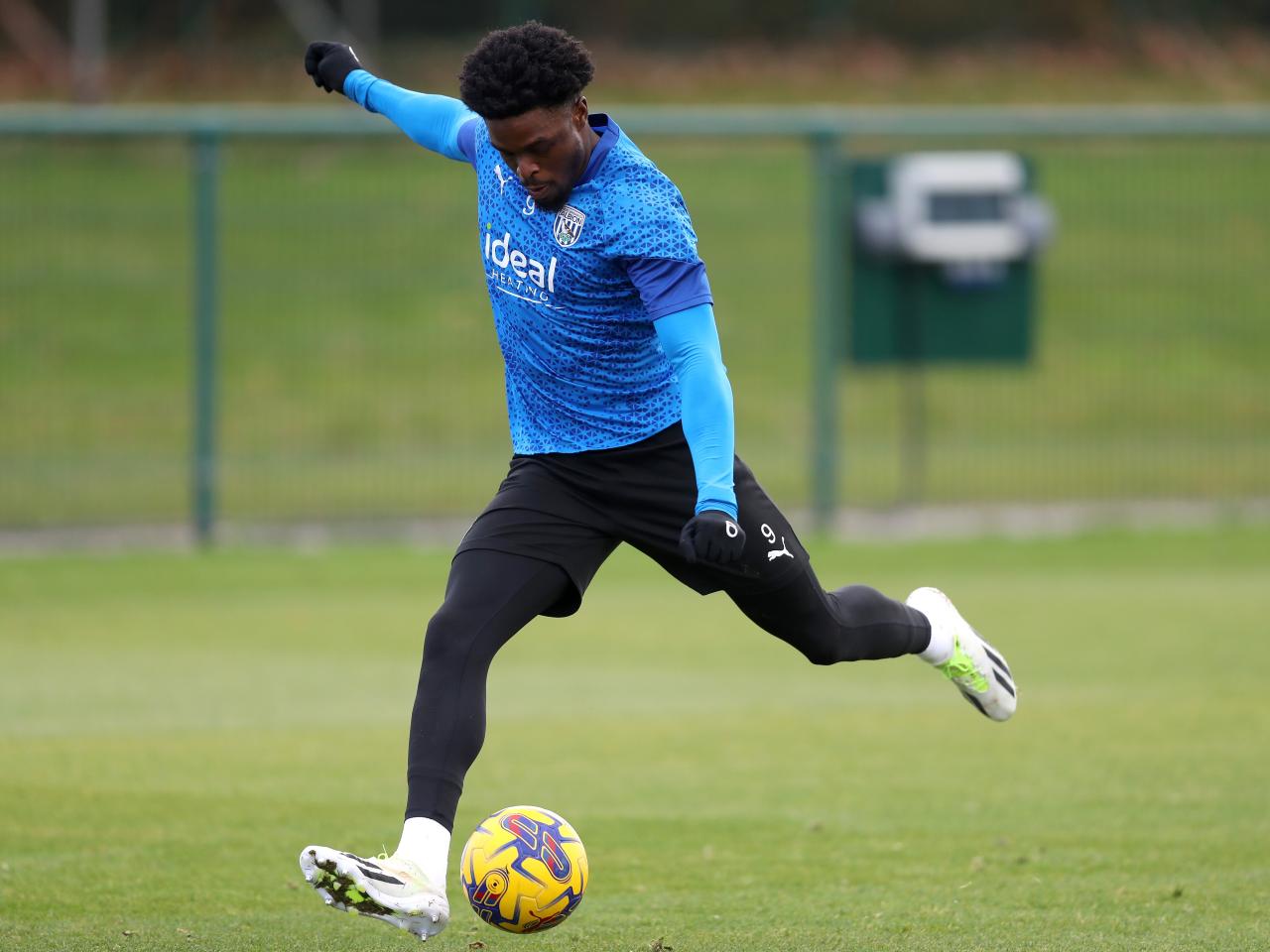 Josh Maja strikes the ball in training 
