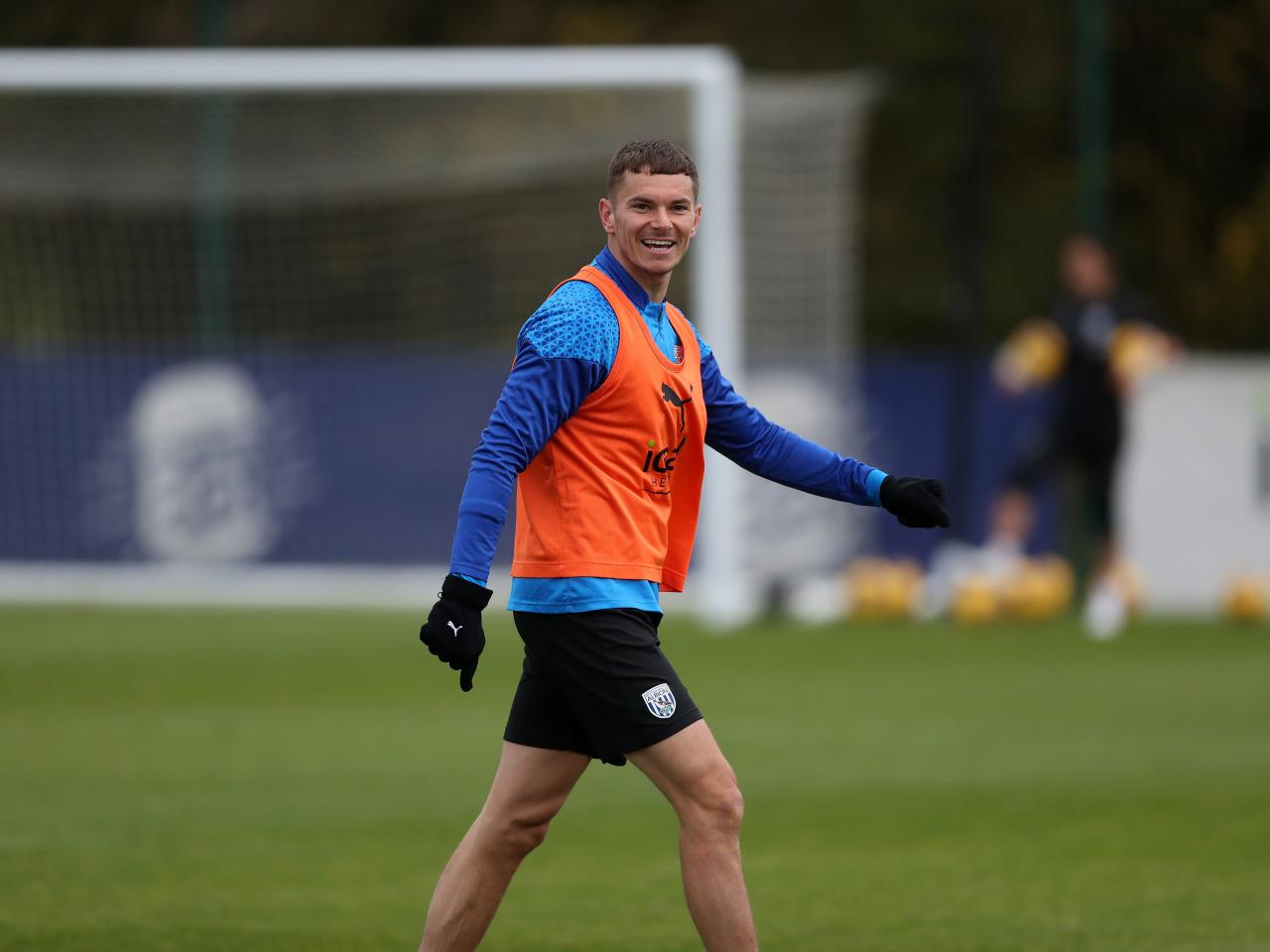 Conor Townsend smiling at the camera during training 