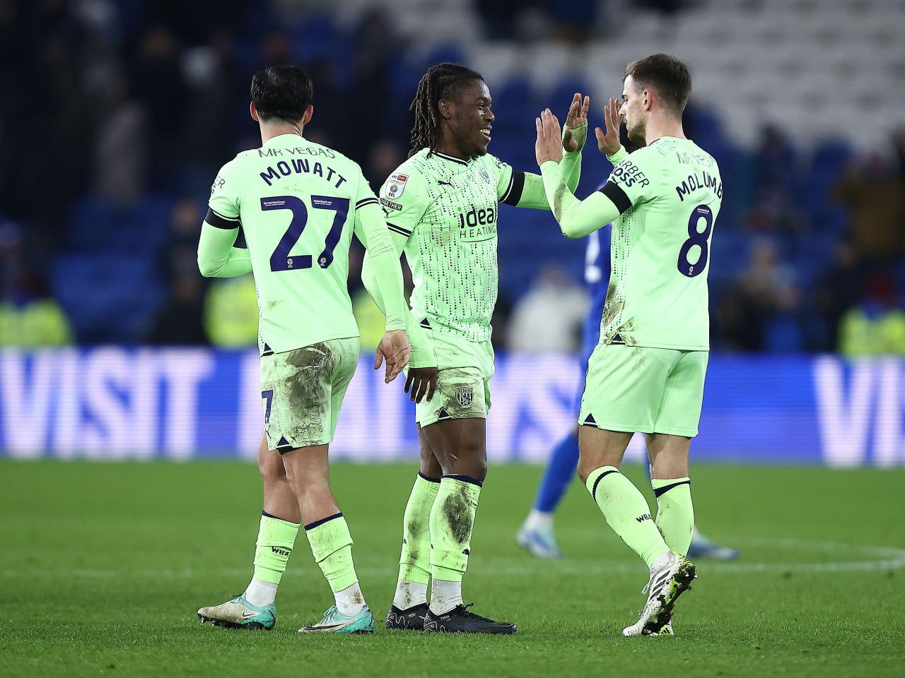A group of Albion players celebrate the win at full-time