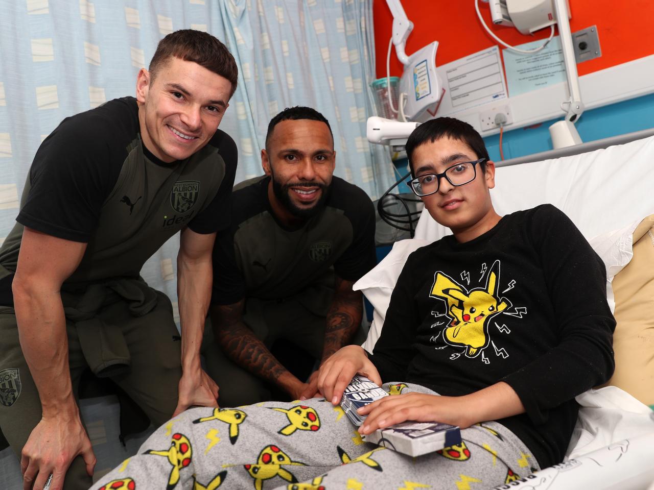 Conor Townsend and Kyle Bartley pose for a photo with patients at Sandwell General Hospital