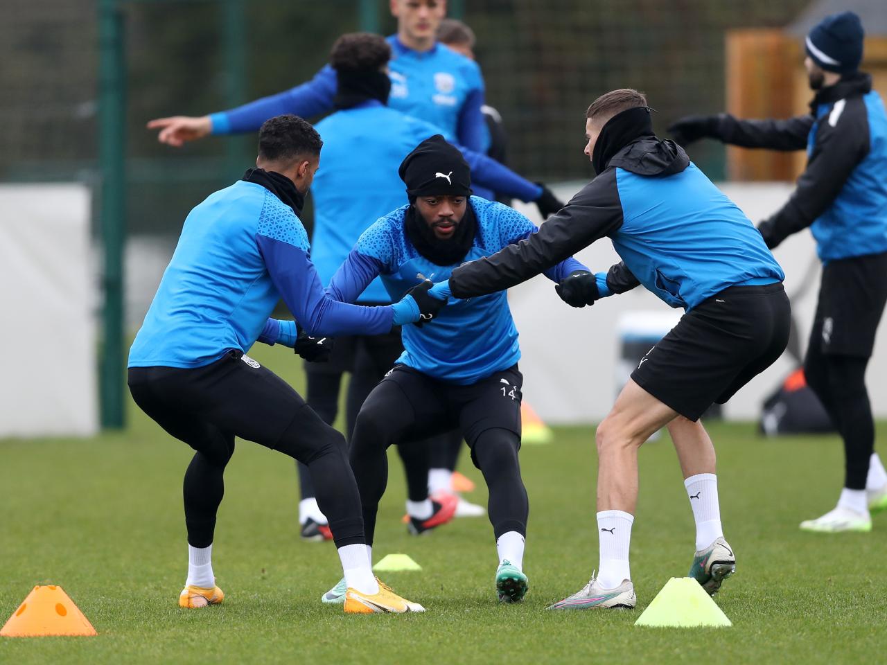 Darnell Furlong, Nathaniel Chalobah and Conor Townsend complete an activity in the warm up