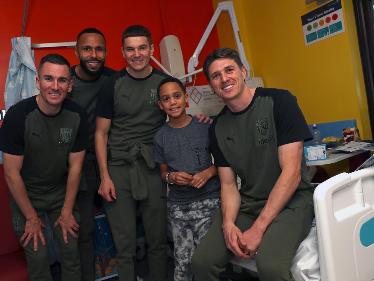 Jed Wallace, Adam Reach, Kyle Bartley and Conor Townsend pose for a photo with patients at Sandwell General Hospital