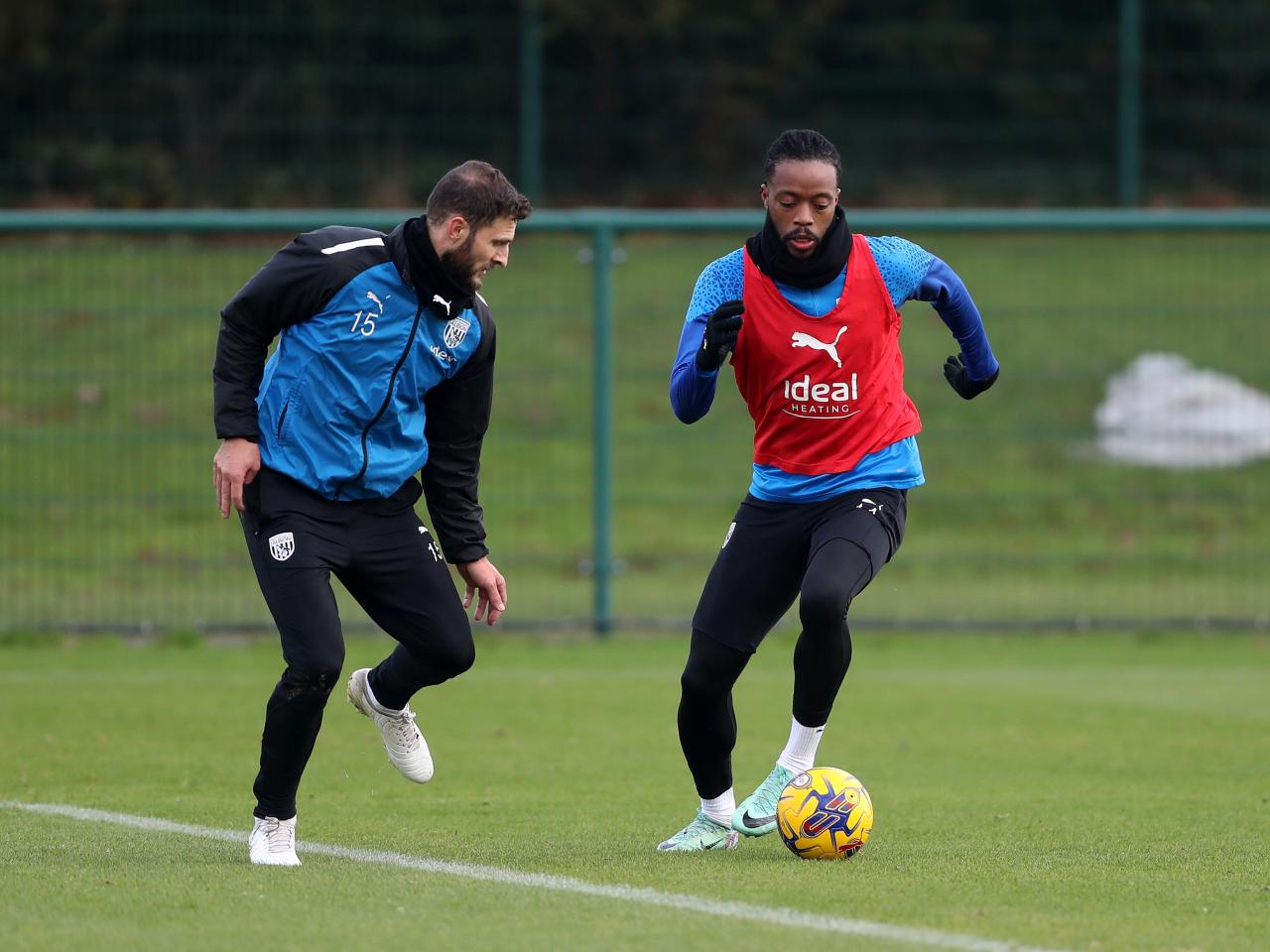 Nathaniel Chalobah running at Erik Pieters in training 