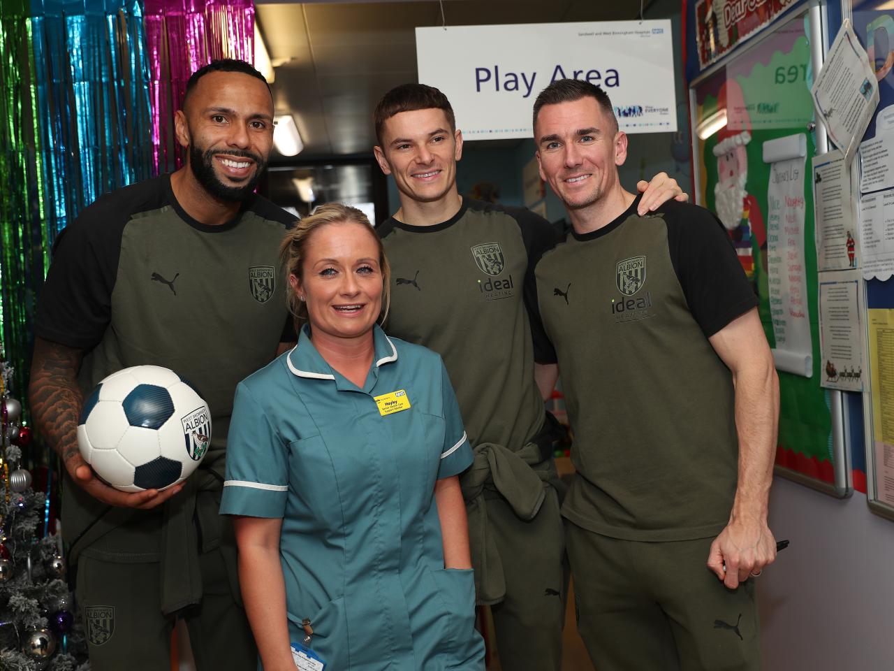 Kyle Bartley, Conor Townsend and Jed Wallace pose for a photo with NHS workers at Sandwell General Hospital