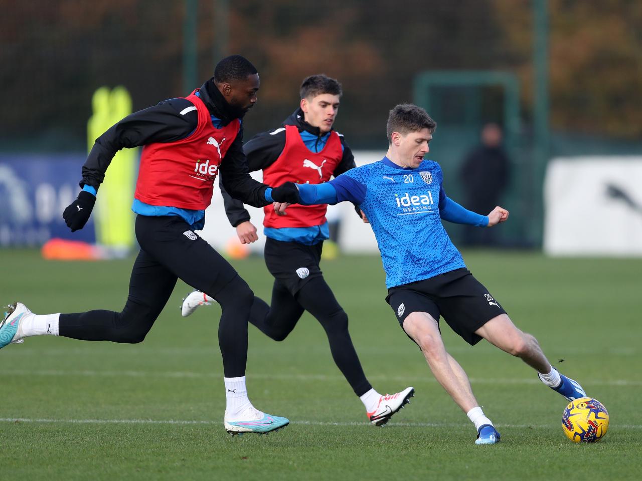 Adam Reach plays a pass in training 