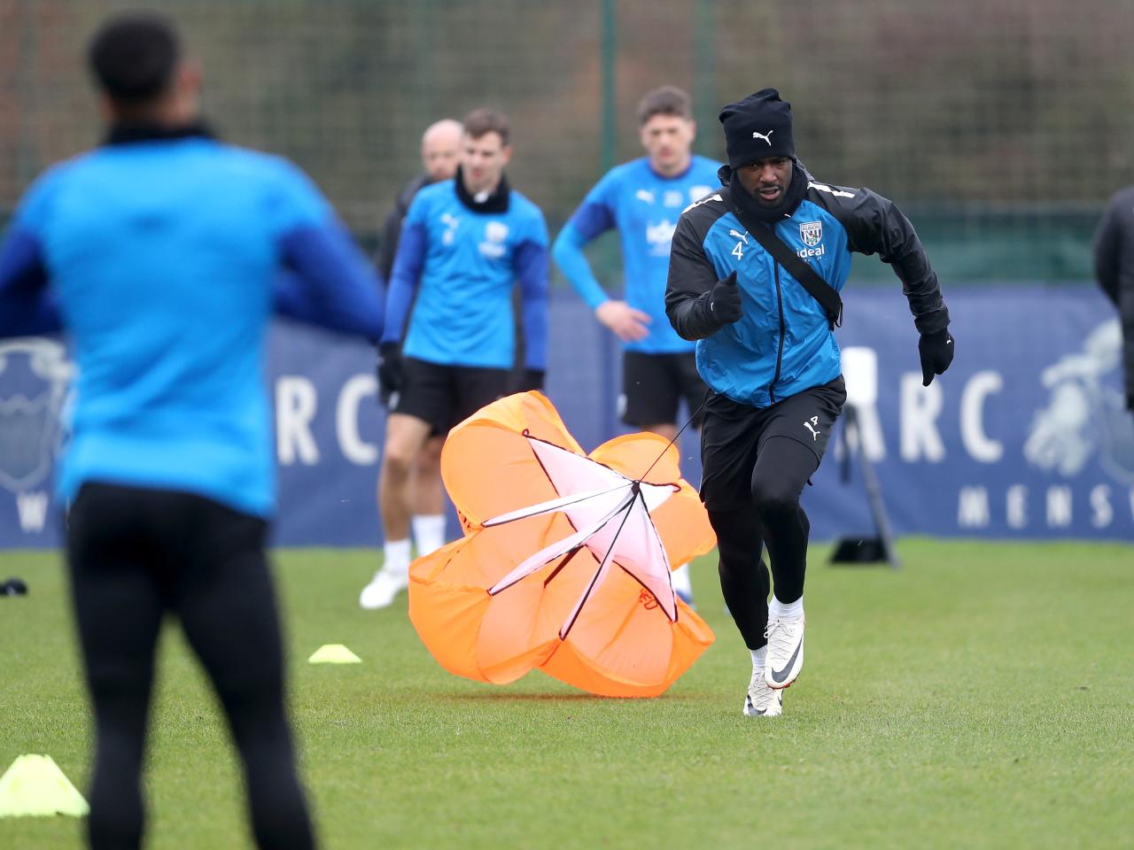 Cedric Kipre running forward with a weight attached behind him