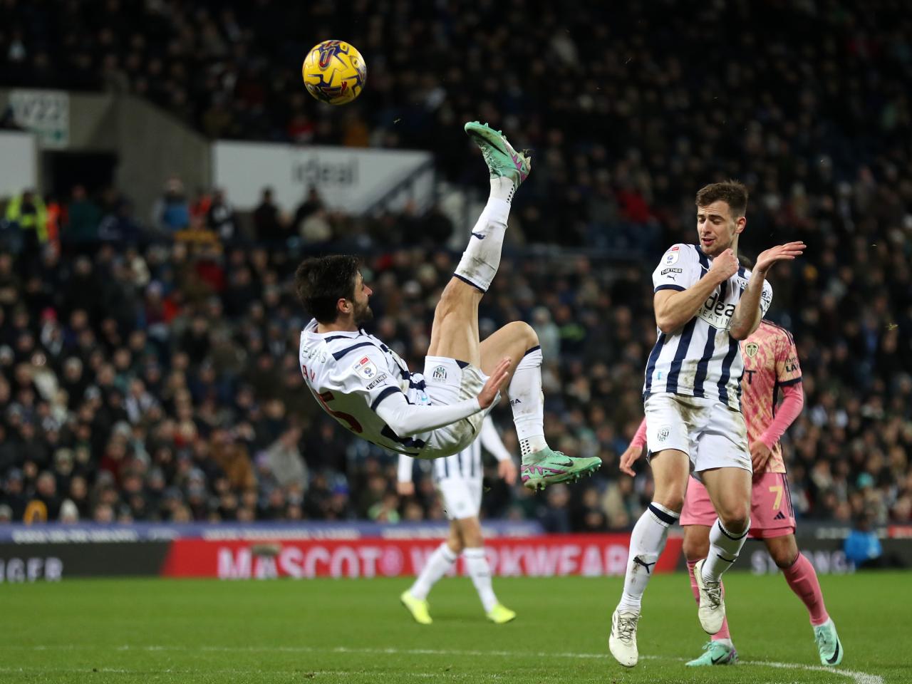 Okay Yokuslu attempts an acrobatic shot against Leeds