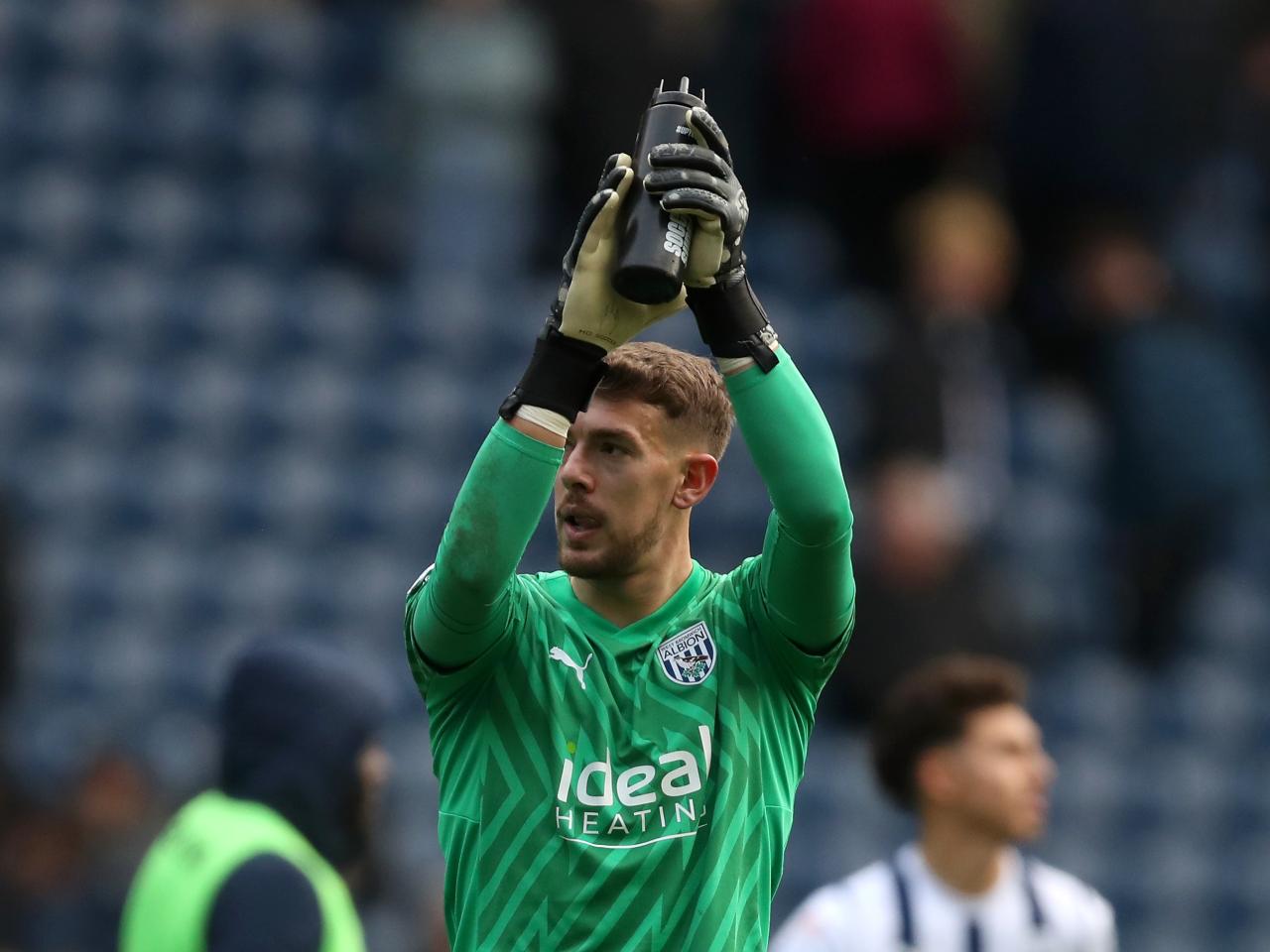 Alex Palmer applauds supporters after the Stoke game