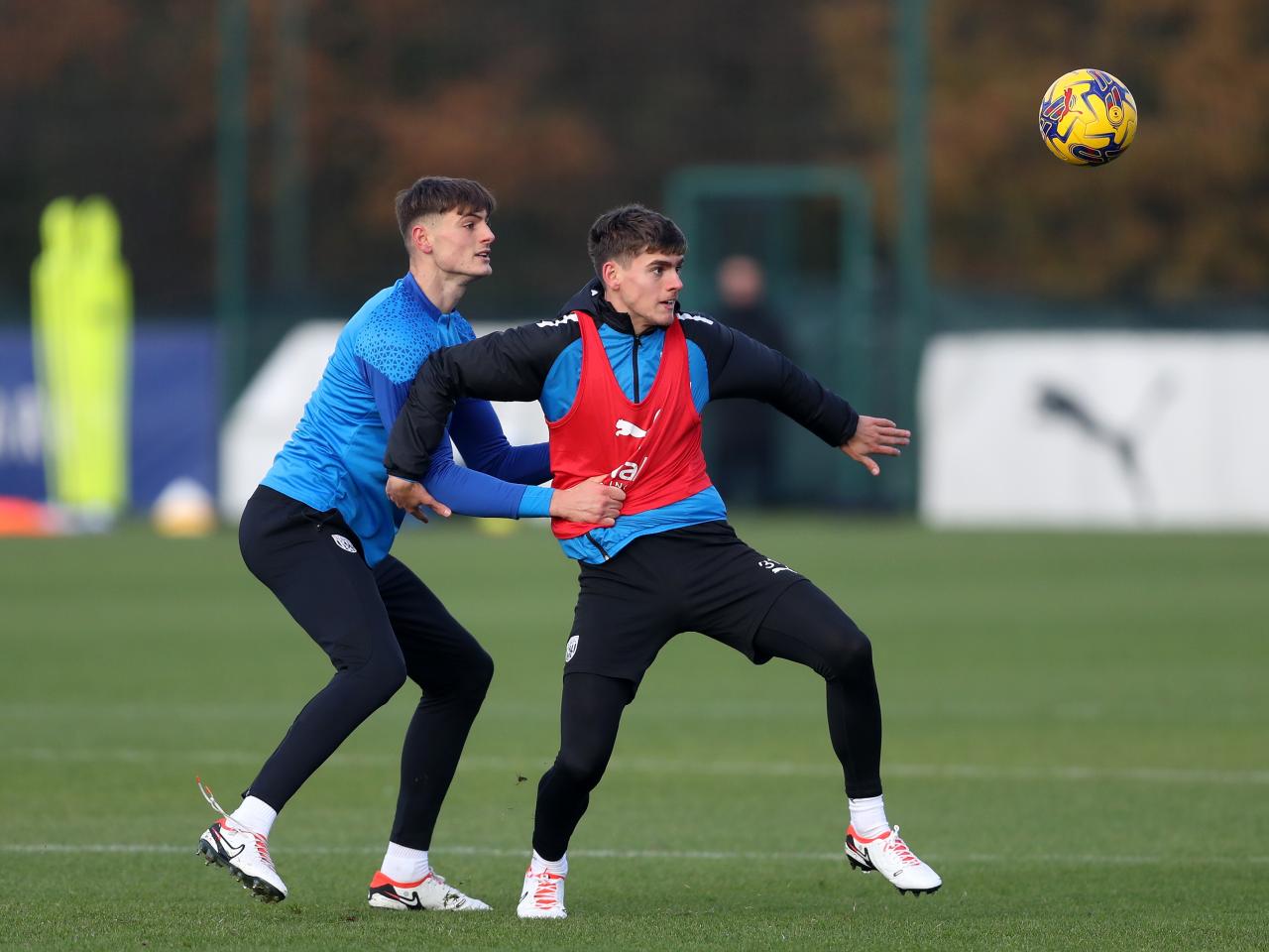 Tom Fellows attempts to keep the ball safe and away from Caleb Taylor in training 
