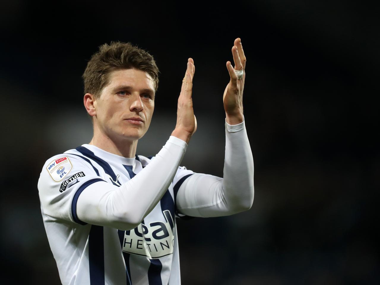 Adam Reach applauds supporters after full-time against Leeds