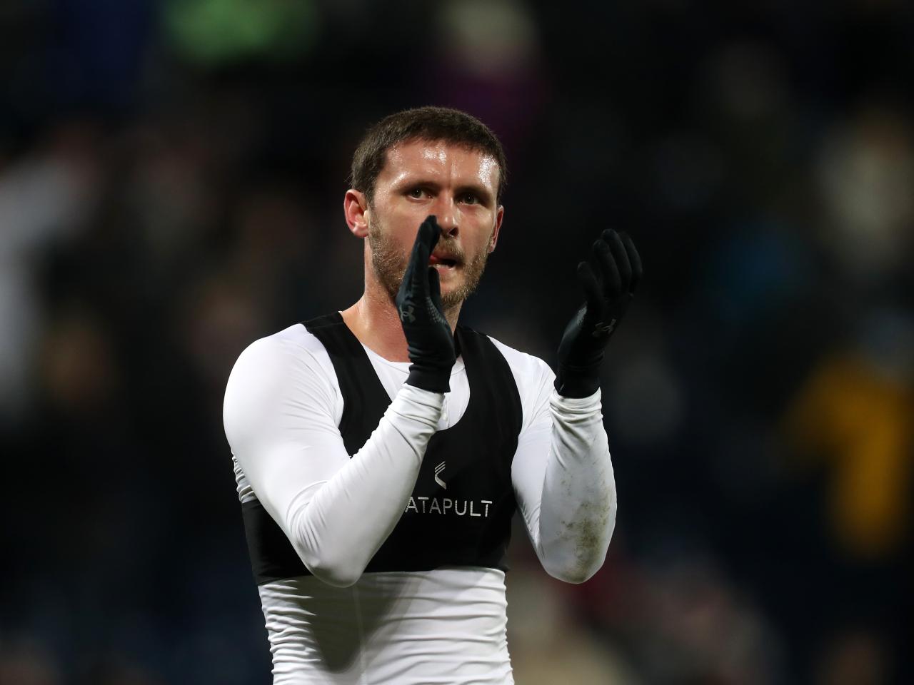 John Swift applauds supporters after full-time against Leeds