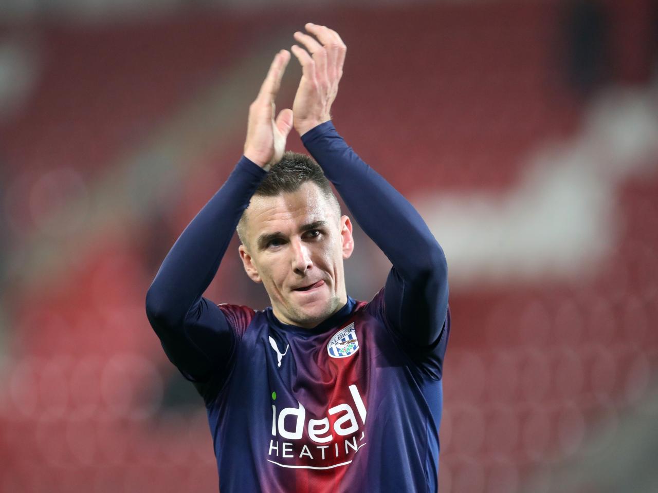 Jed Wallace applauds Albion fans after the match