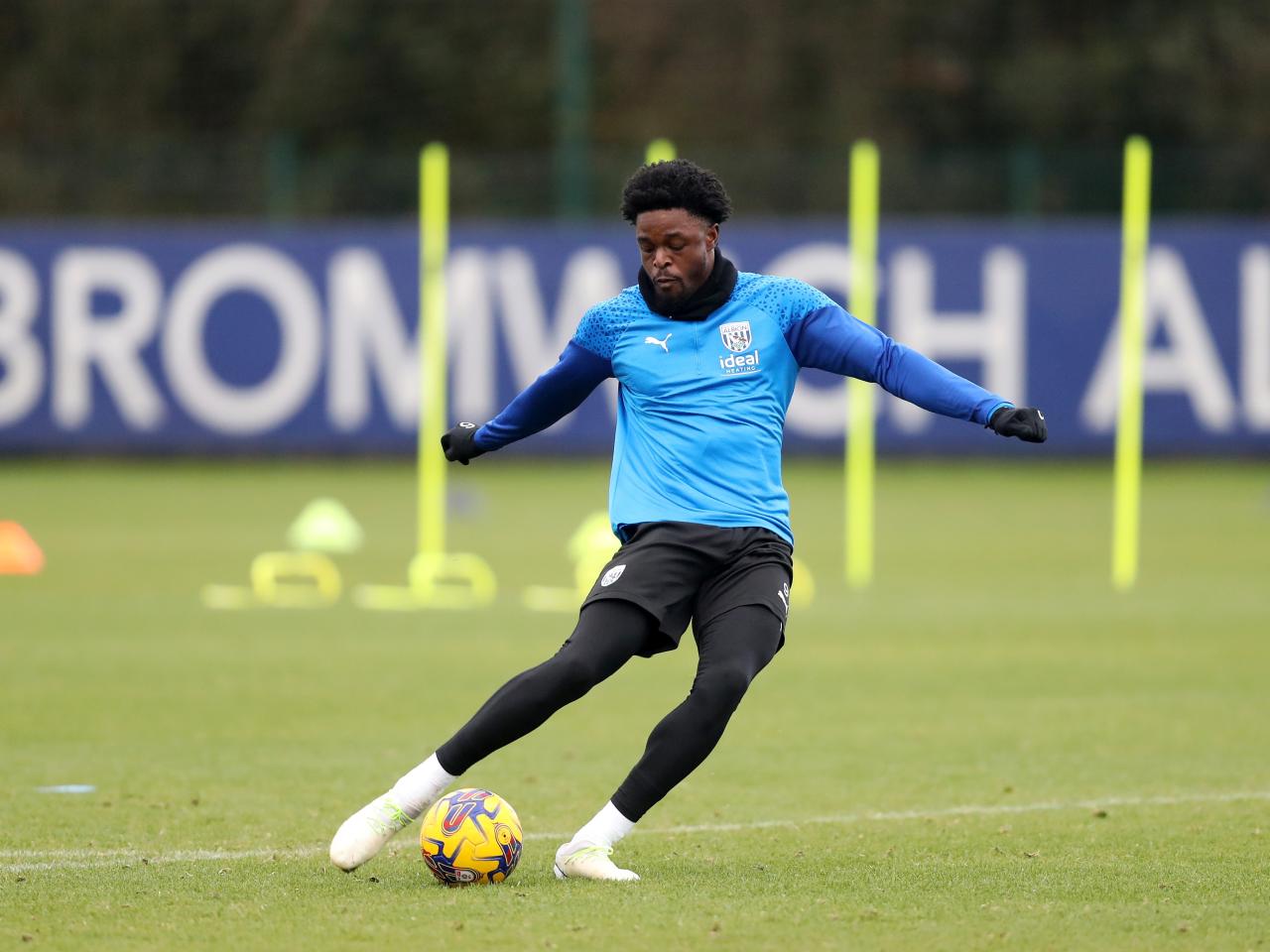 Josh Maja strikes the ball in training 