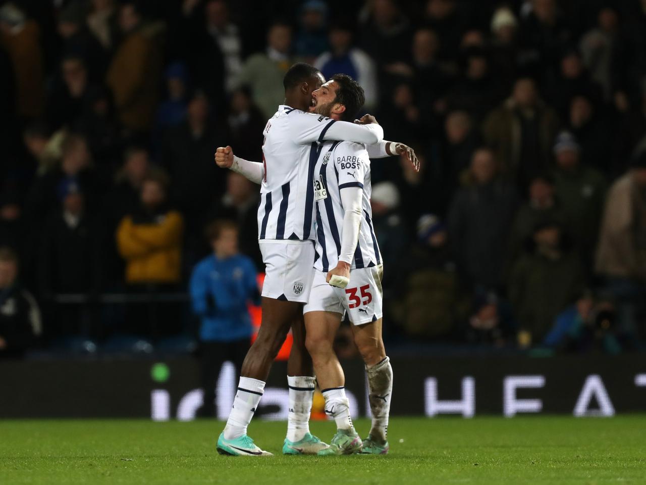 Semi Ajayi and Okay Yokuslu share an embrace at full-time against Leeds 