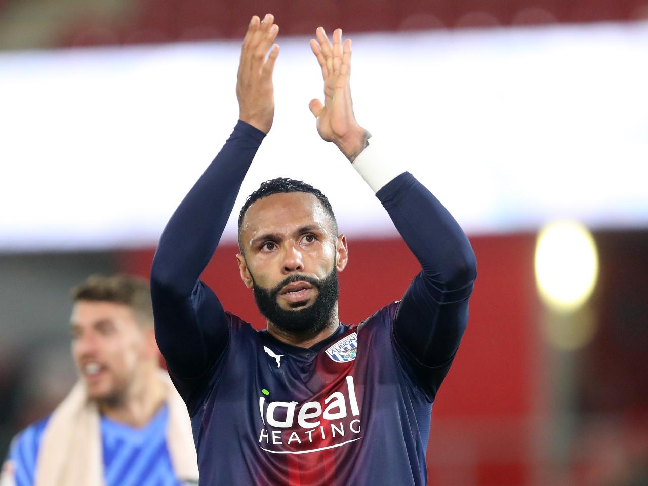 Kyle Bartley applauds Albion fans after the match