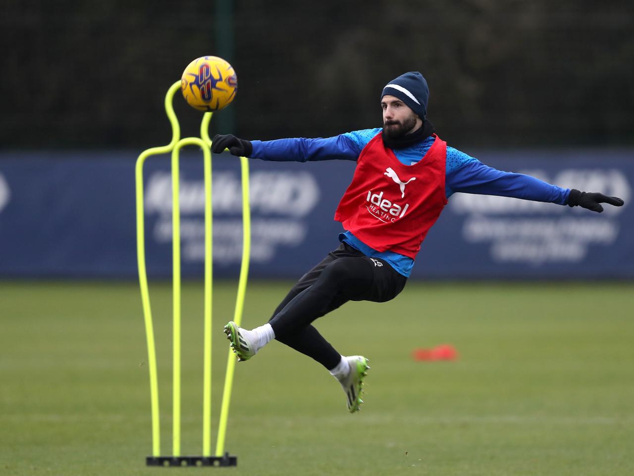 Pipa prepares to acrobatically kick the ball in training 