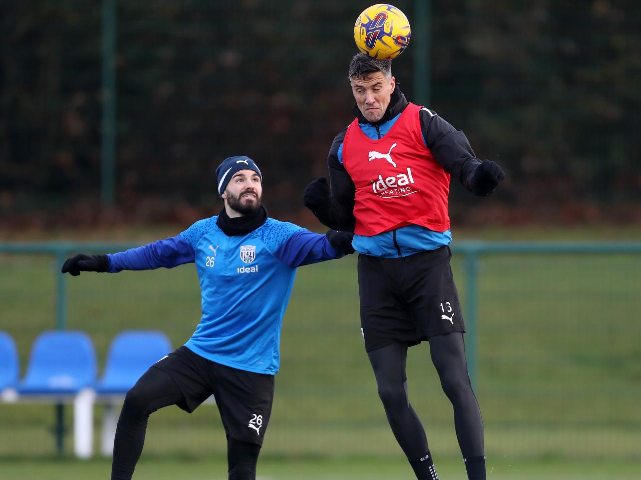 Martin Kelly jumps higher than Pipa and heads the ball away