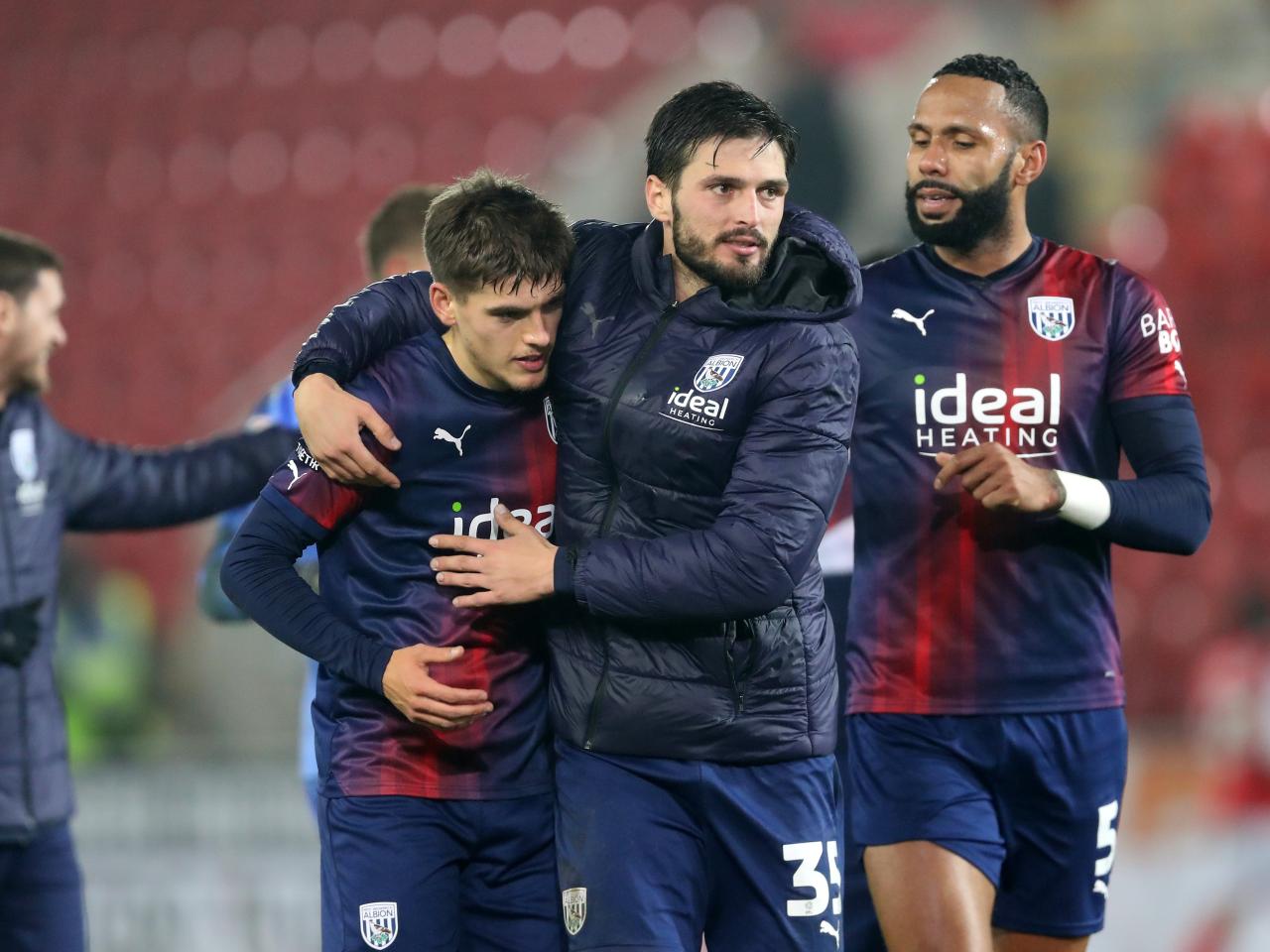 Okay Yokuslu hugs Tom Fellows at full-time