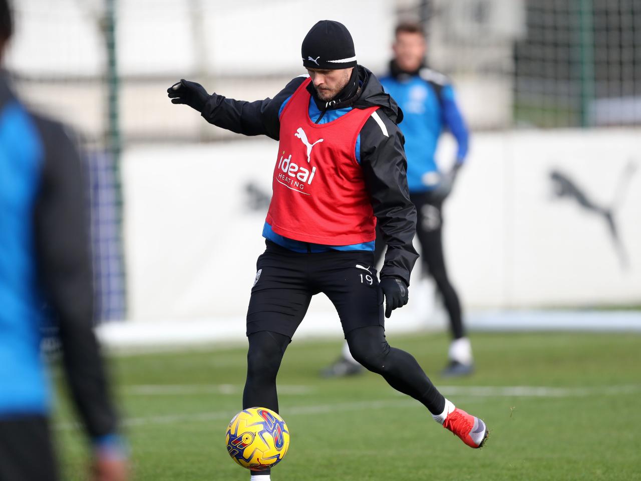 John Swift makes a pass in training