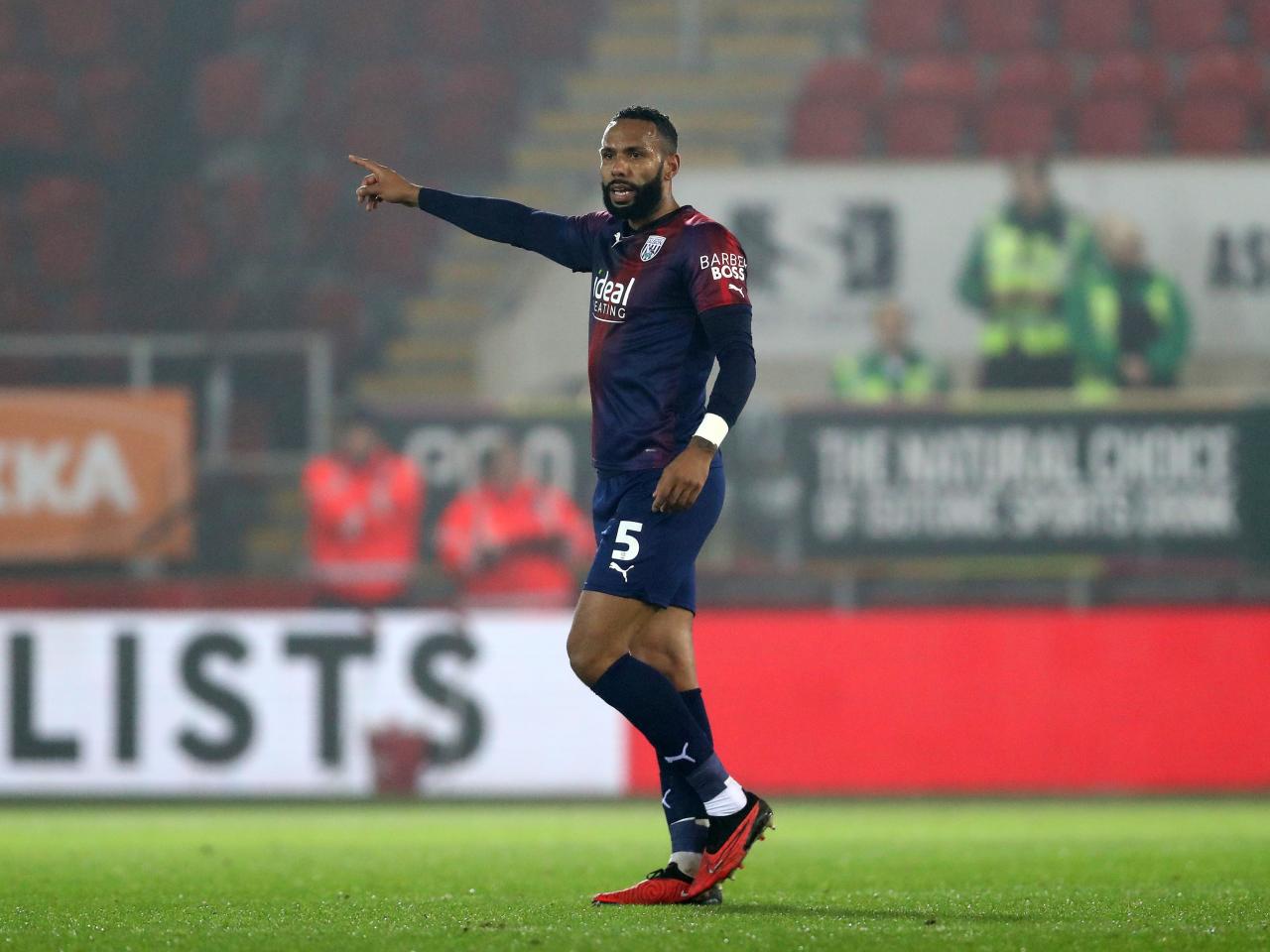 Kyle Bartley pointing to his right against Rotherham