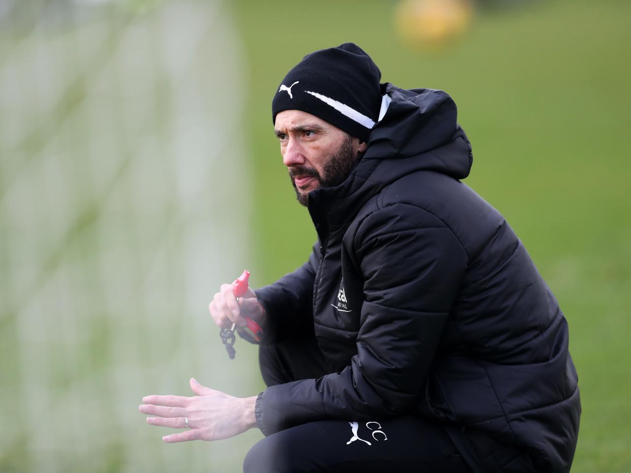 Carlos Corberán watches over training 
