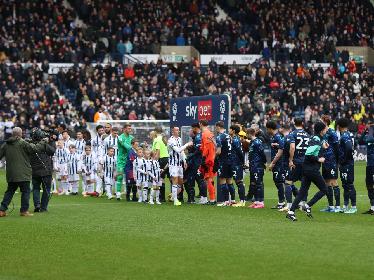 Albion players and Stoke players lining up before the game
