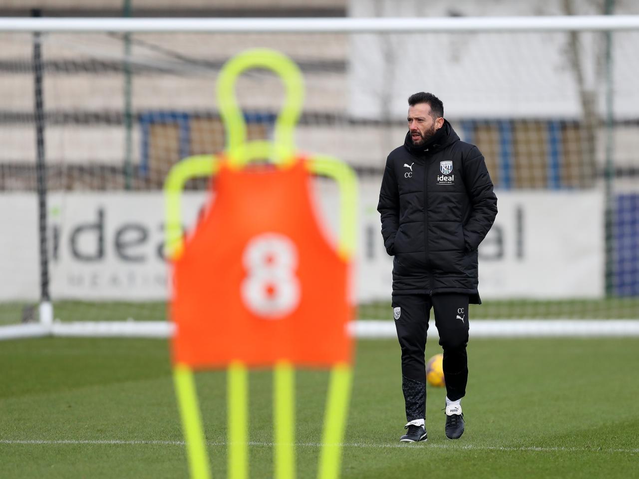 Carlos Corberán watching training 