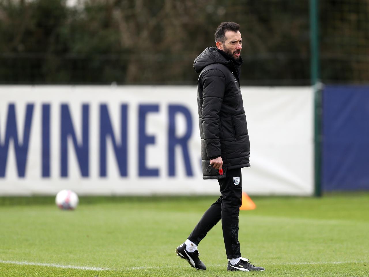 Carlos Corberán watching training 