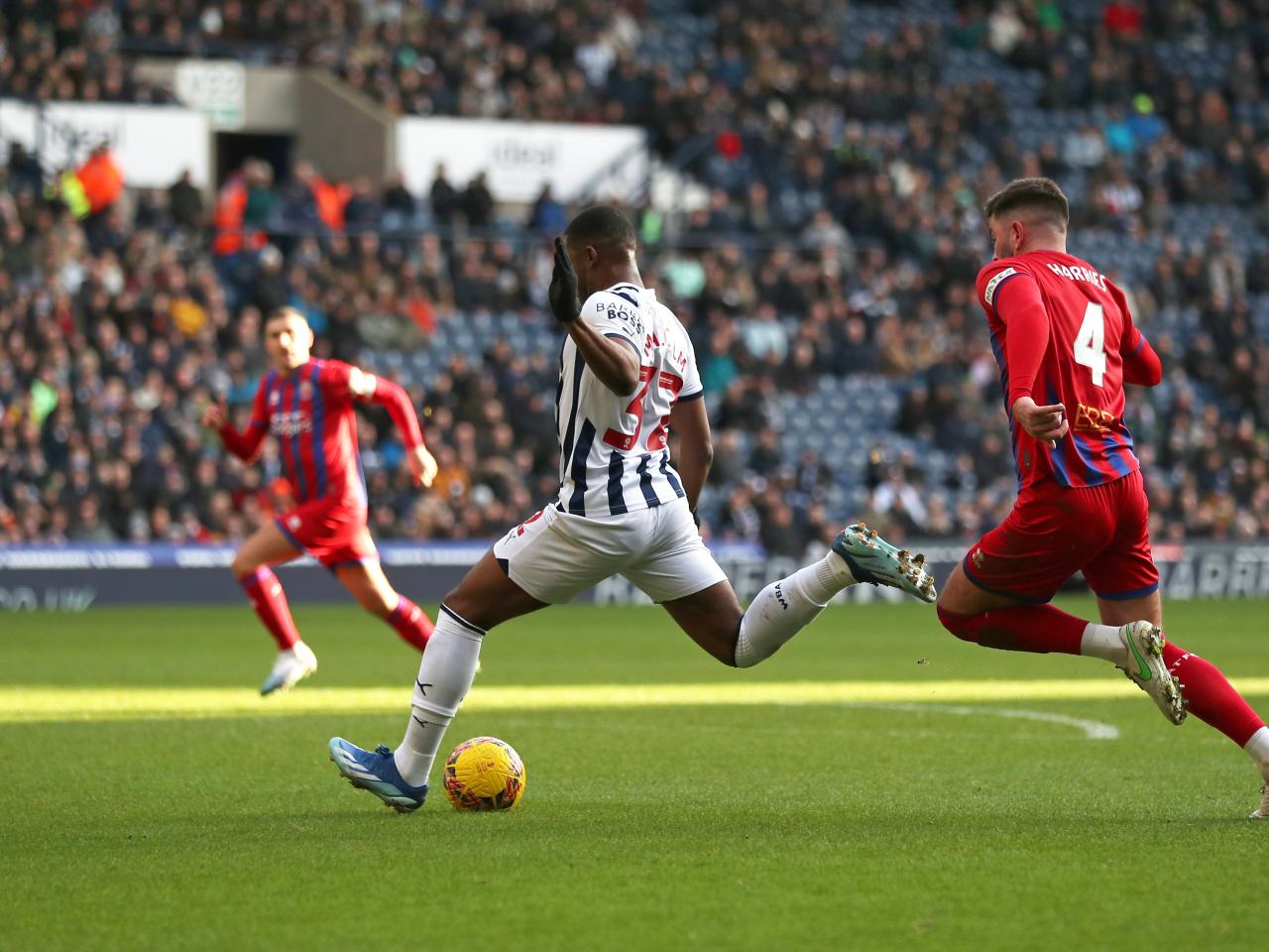 Jovan Malcolm shoots at goal against Aldershot and scores