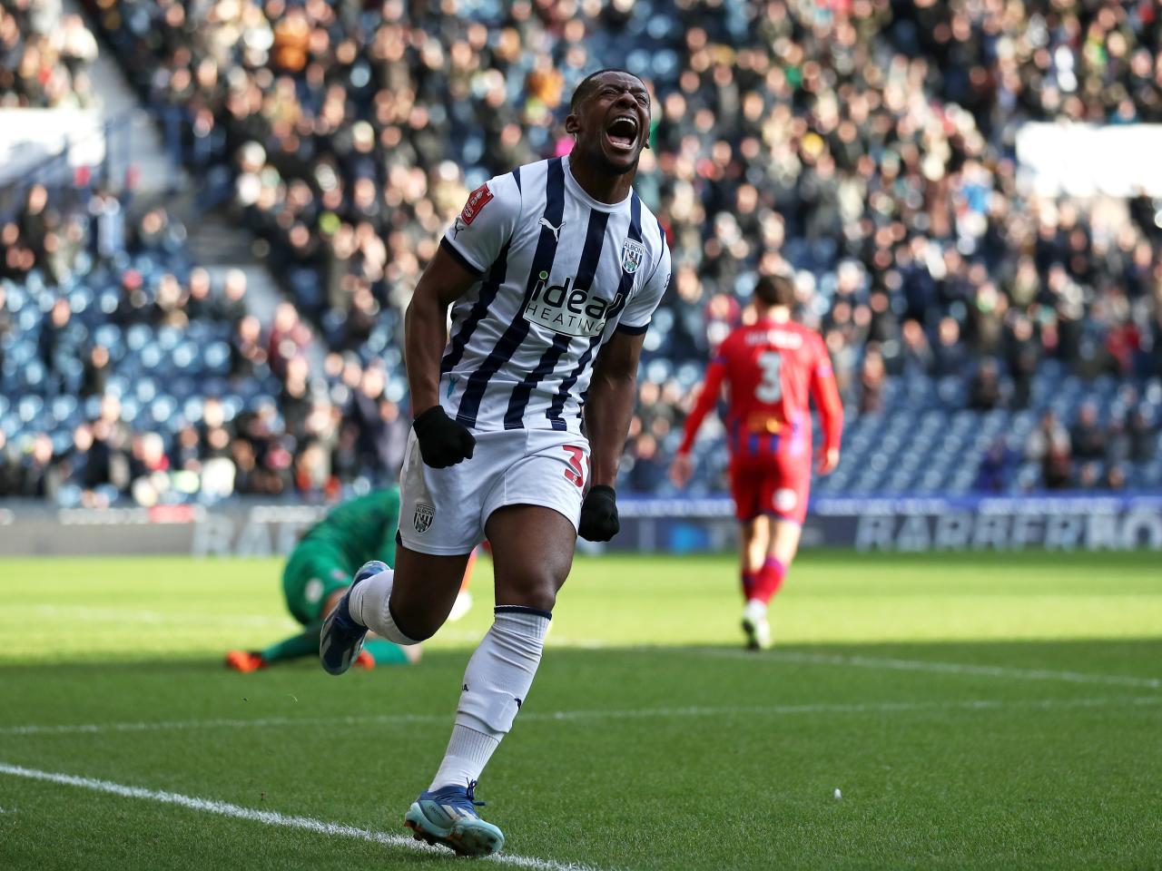 Jovan Malcolm celebrates scoring against Aldershot