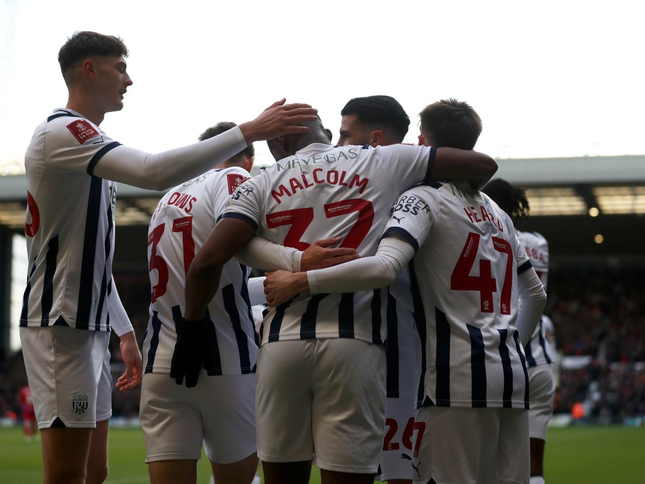 Jovan Malcolm celebrates scoring against Aldershot with team-mates